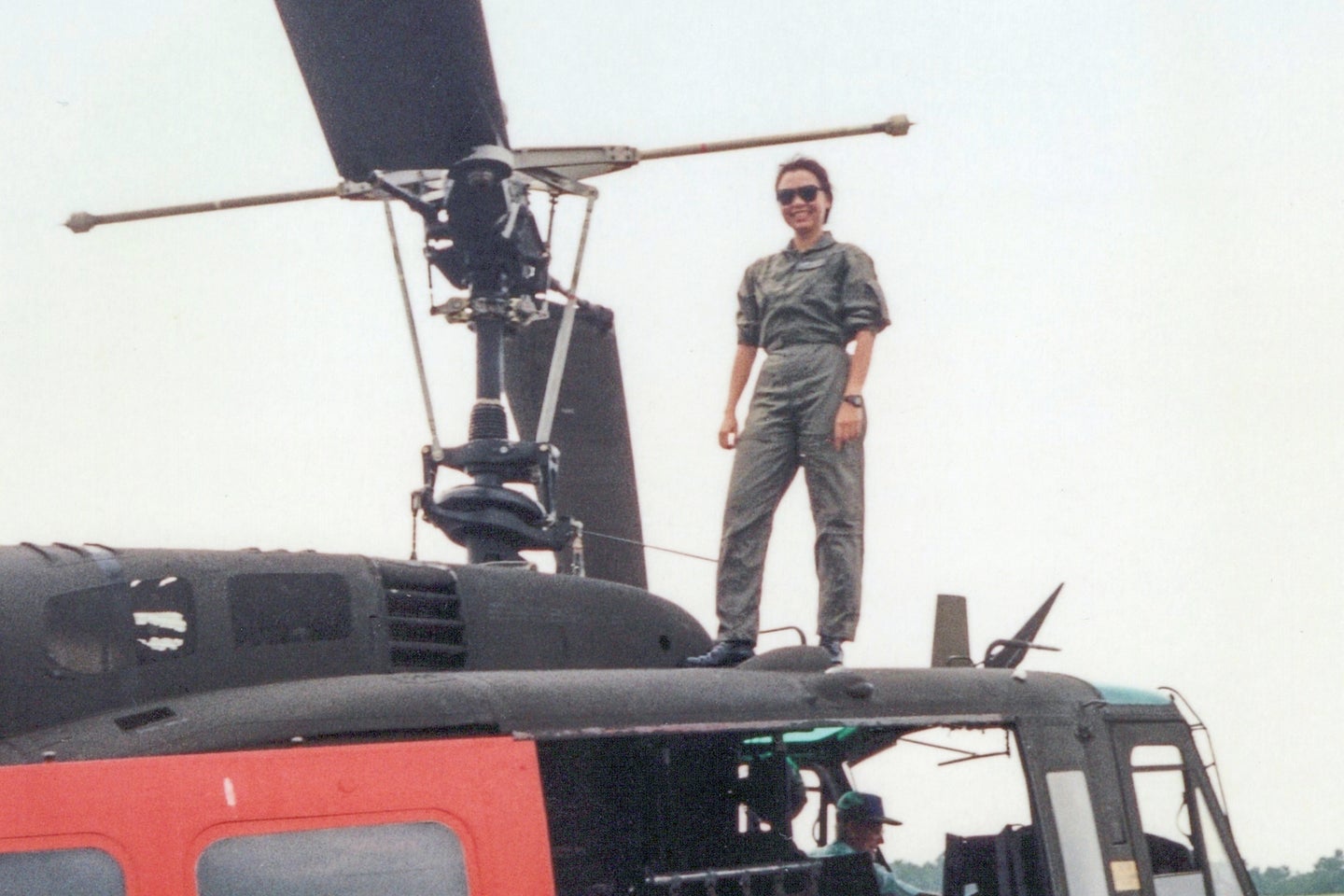 Senator Tammy Duckworth stands on a helicopter.