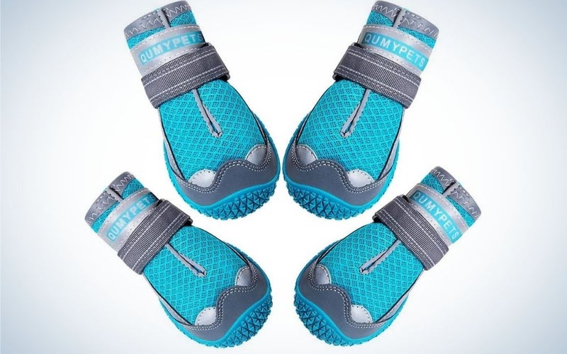Four blue and grey pair of socks with reflective and adjustable straps.