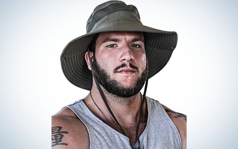 A man with a beard wearing a fishing hat