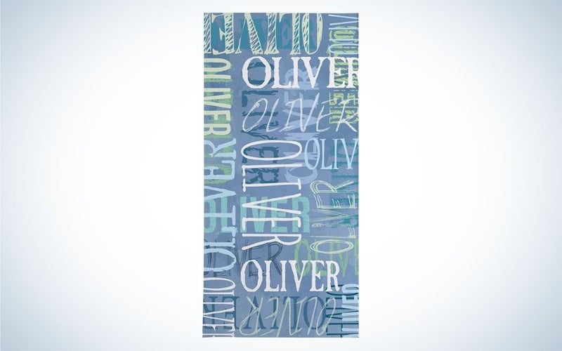 Light blue beach towel with different writings on it