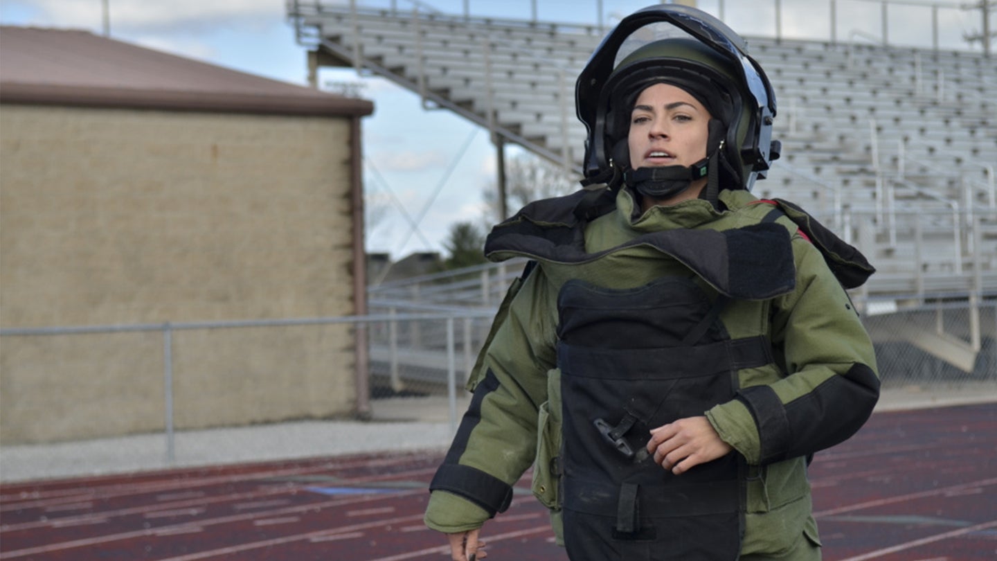 Meet the woman who set a record for running in a 96-pound bomb suit