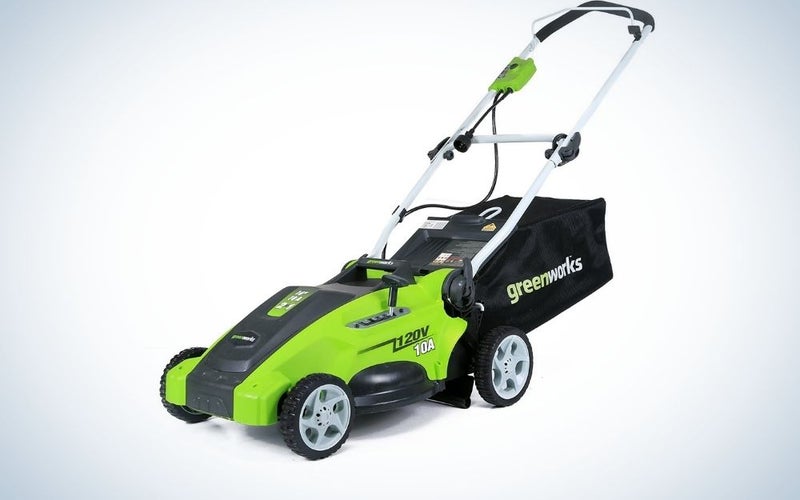 Four-wheeled green and black grass mower.