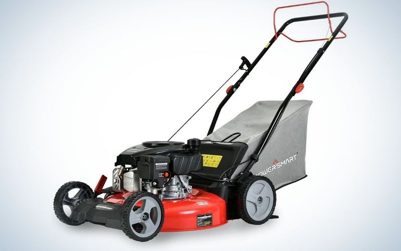 PowerSmart black lawn mower and some red four-wheeled parts and a grey back piece.
