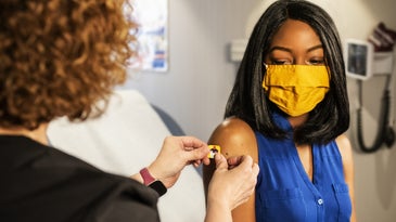 person getting a covid-19 vaccine