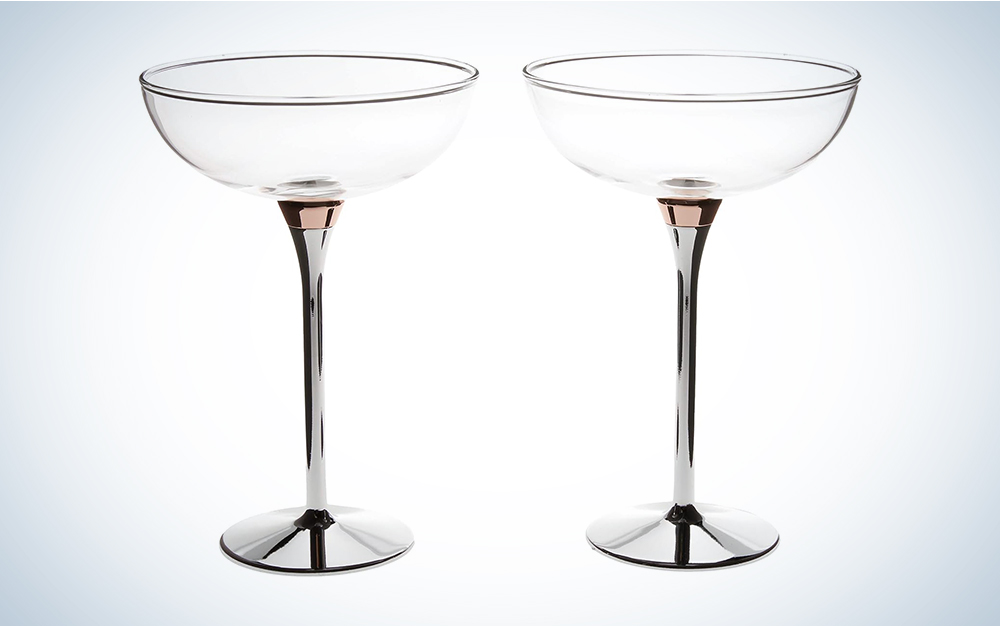 Two Kate Spade Rosy Glow champagne coupes with shiny rose gold and zinc alloy stems side by side