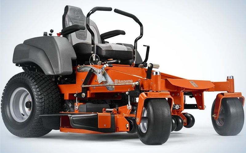 A large lawn mower in black and orange as well as with the elongated front, as well as two levers in the steering wheel function.
