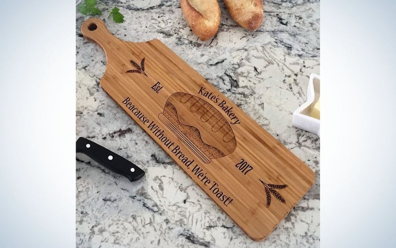 A personalized wooden cutting board as a Mother's Day gift