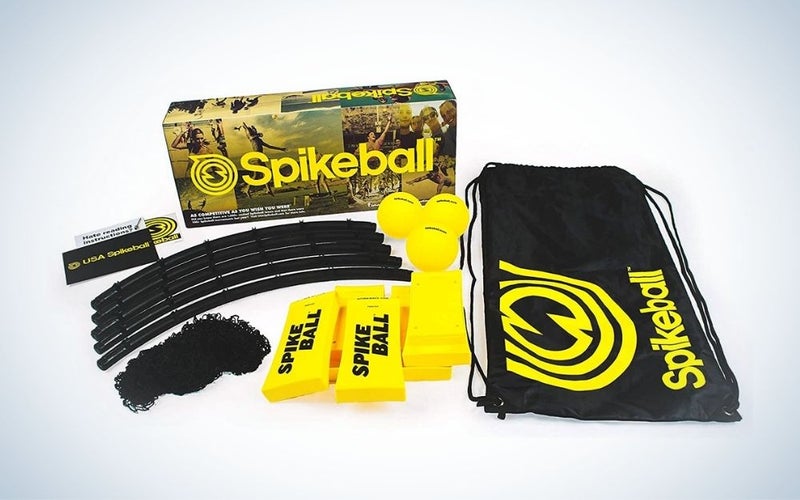 Black and yellow Spikeball 3 ball kit and a carrying bag for backyard games