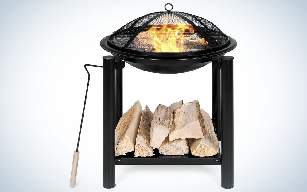 Black outdoor fire pit bowl with shelf for wood sticks