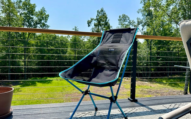 helinox chair on a deck with forest behind