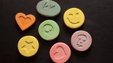 Colorful ecstasy pills with logos
