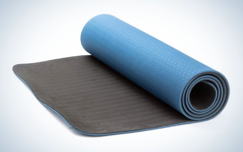 Blue and black, rolled yoga mat