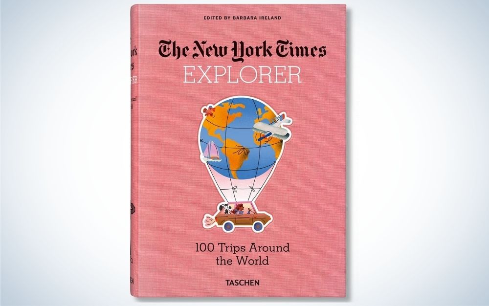 "The New York Times Explorer. 100 Trips Around the World" with pink cover, gift guide for grads who love to read