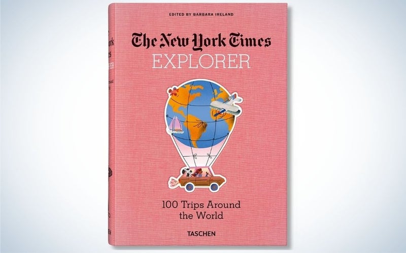 "The New York Times Explorer. 100 Trips Around the World" with pink cover, gift guide for grads who love to read