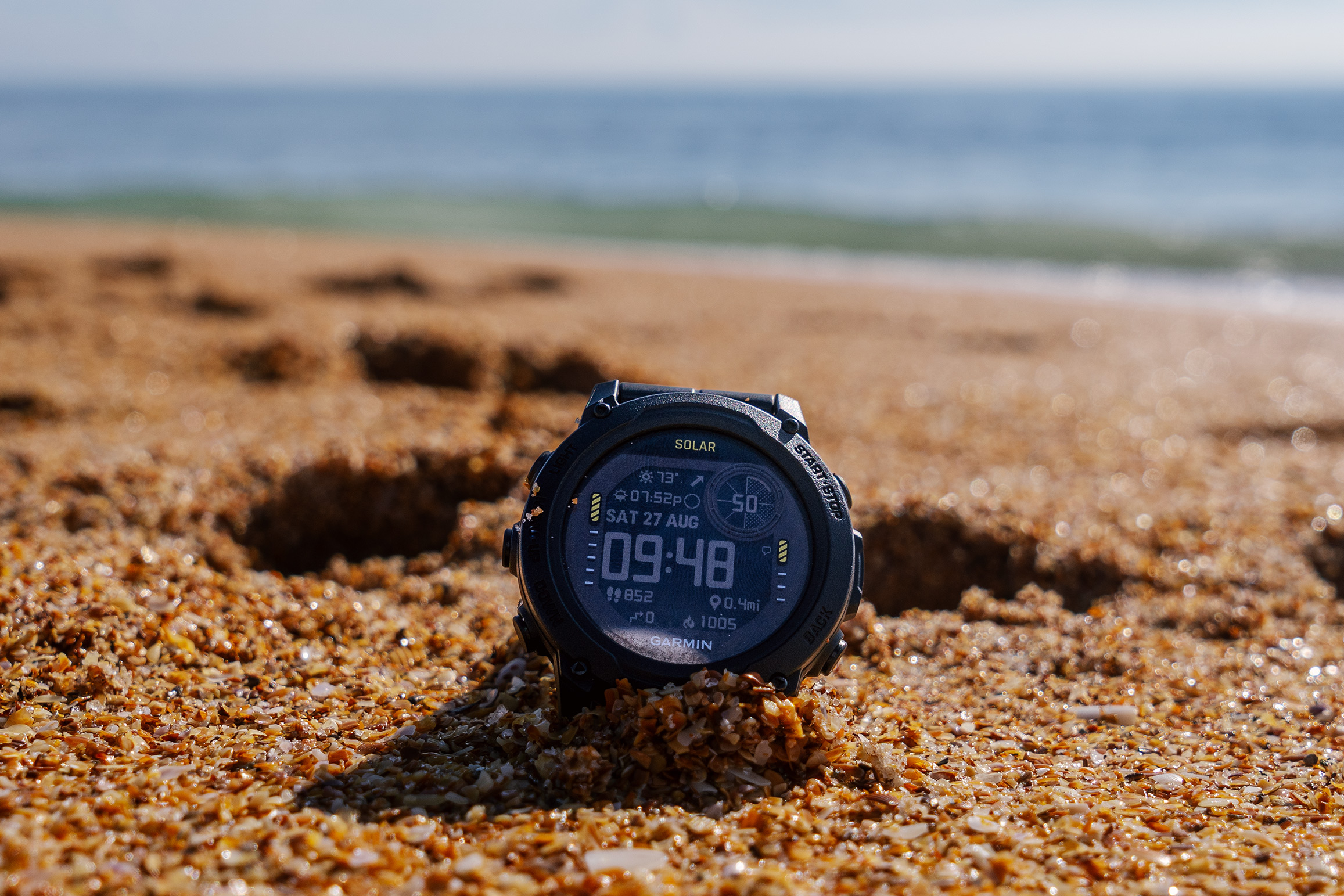 Garmin Descent G1 Solar best Garmin watch for diving in the sand on a beach