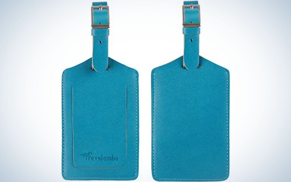 Two blue luggage tags with a head of a zipper in the top of them.