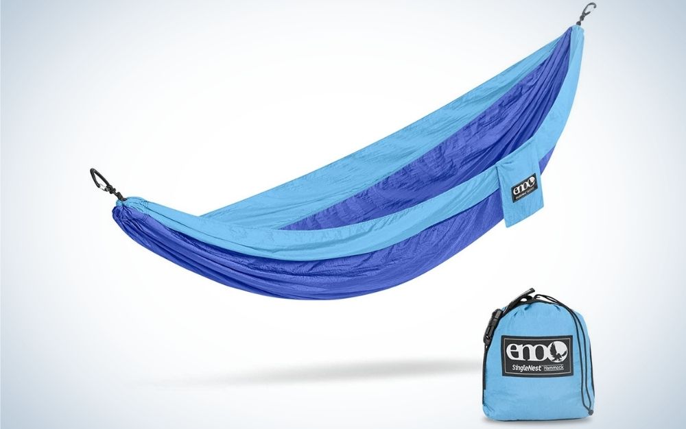 A strong and light blue color hammock in a large shape and with a small blue bag under it.