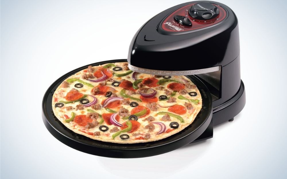 A black electric oven all with a few buttons on the top of it and with a baked pizza in it.
