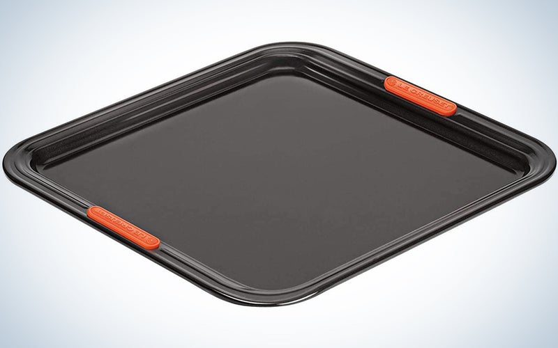 gray baking tray with orange handles built in