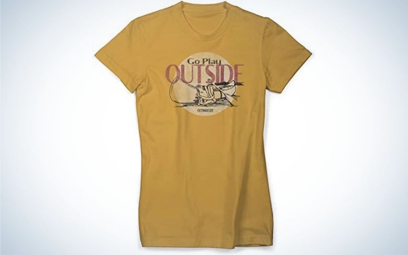 An yellow T shirt with red lettering in front of it.