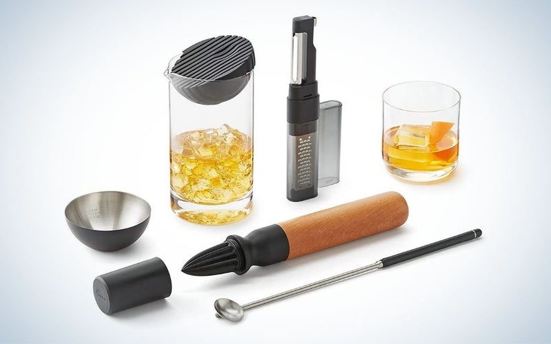 Bar tool set cocktails kit including spin spoon, muddler & reamer, silicone strainer & jigger, garnish tool, and mixing glass.