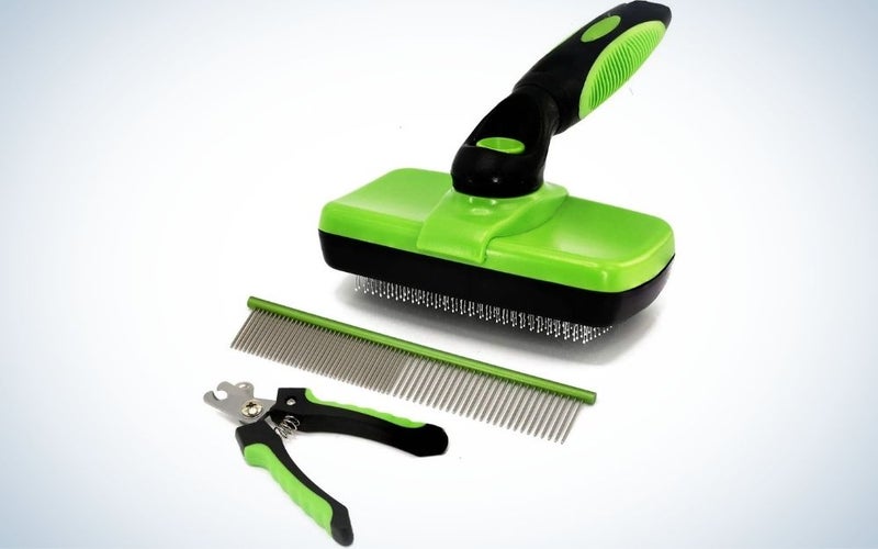 A grooming kit for dogs and cats in green with a black tail, as well as a pet clipper and a green comb as well.