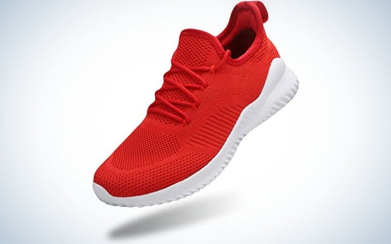 A sports sneaker with a white sole and a fiery red sneaker material.
