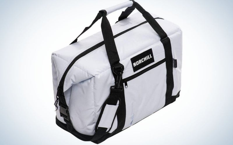 A rectangular shape black and white bag with the brand name into it and with a black zipper in the middle of the bag.
