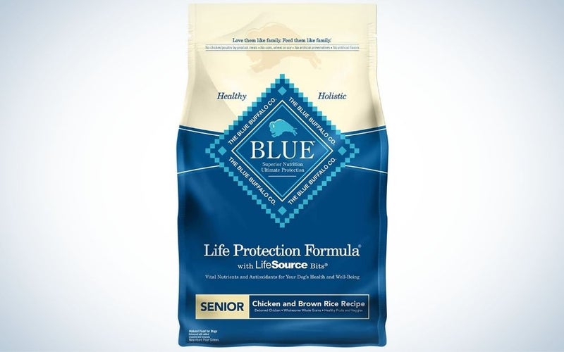 Chicken and brown rice flavored dry dog food on a blue and and light color package