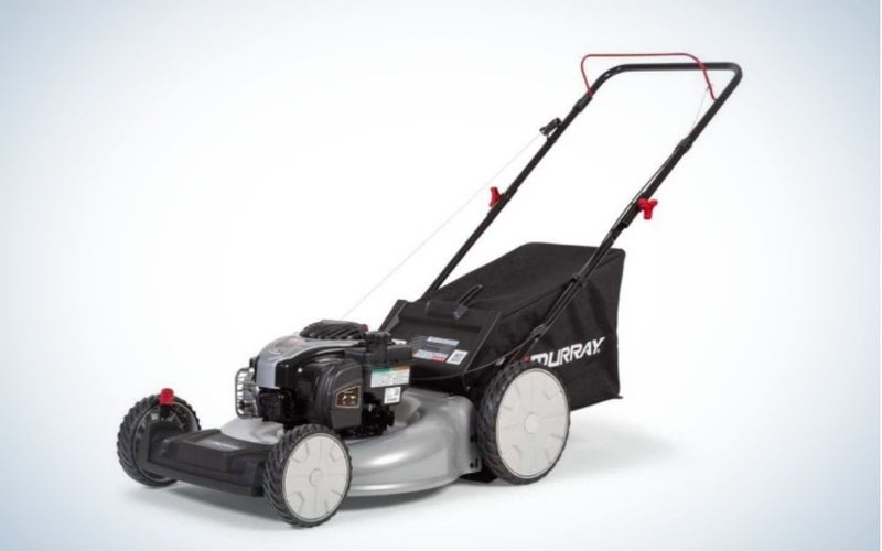A black and gray lawn mower with four wheels and a handrail.