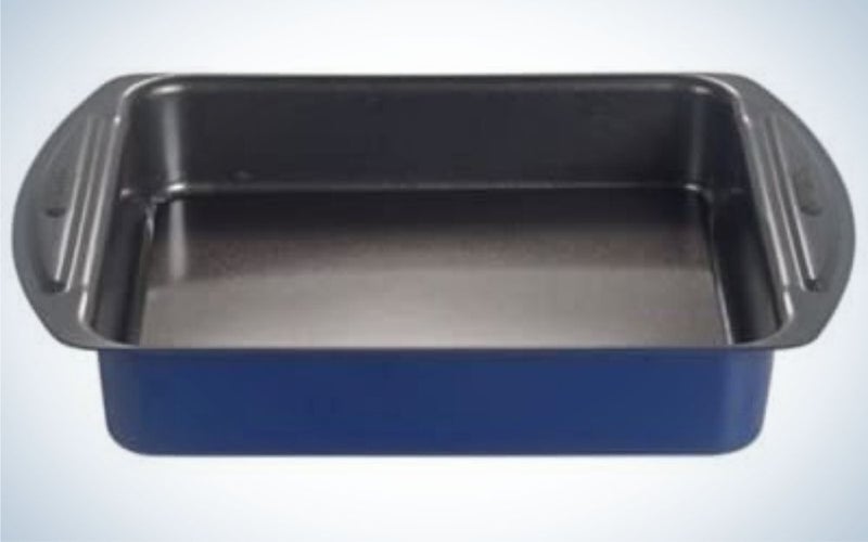 A large rectangular pan dark black and dark blue with two wide side pieces where it can be caught.