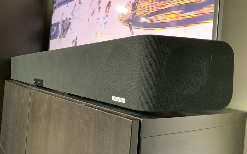 The Sennheiser AMBEO Soundbar in front of a flatscreen TV