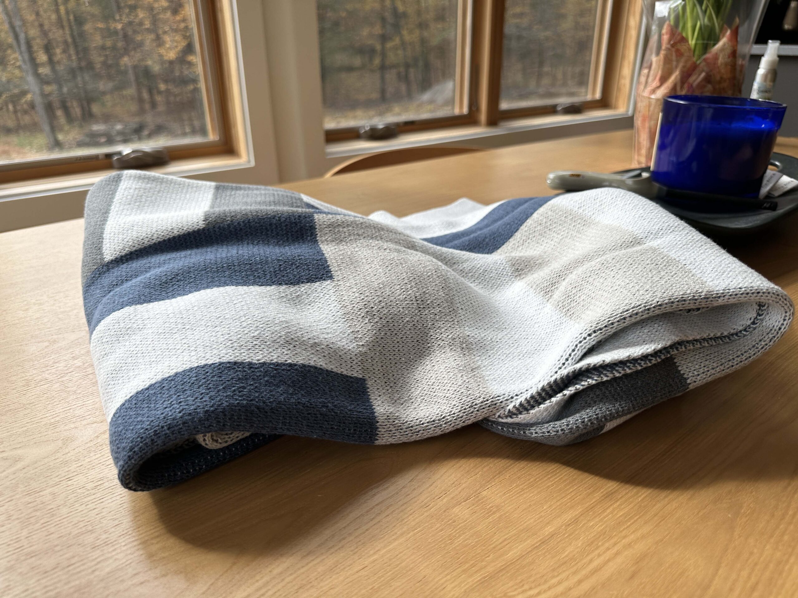 Double Stitch by Bedsure Throw Blanket on a wooden table