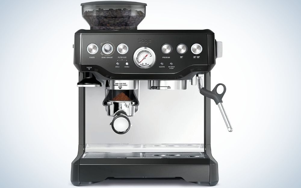 A coffee making machine which is all black and with the top full of silver buttons.