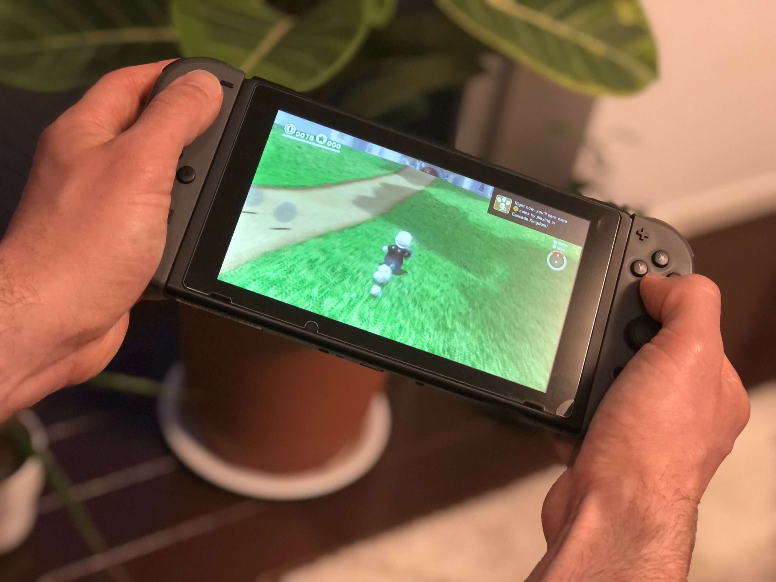 Nintendo Switch handheld running Mario Odyssey