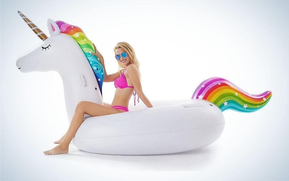Girl sitting on a inflatable pool float