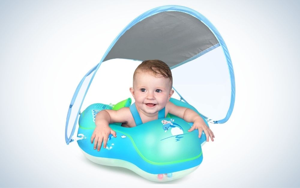 Baby a blue inflatable swimming pool float with sun protection canopy
