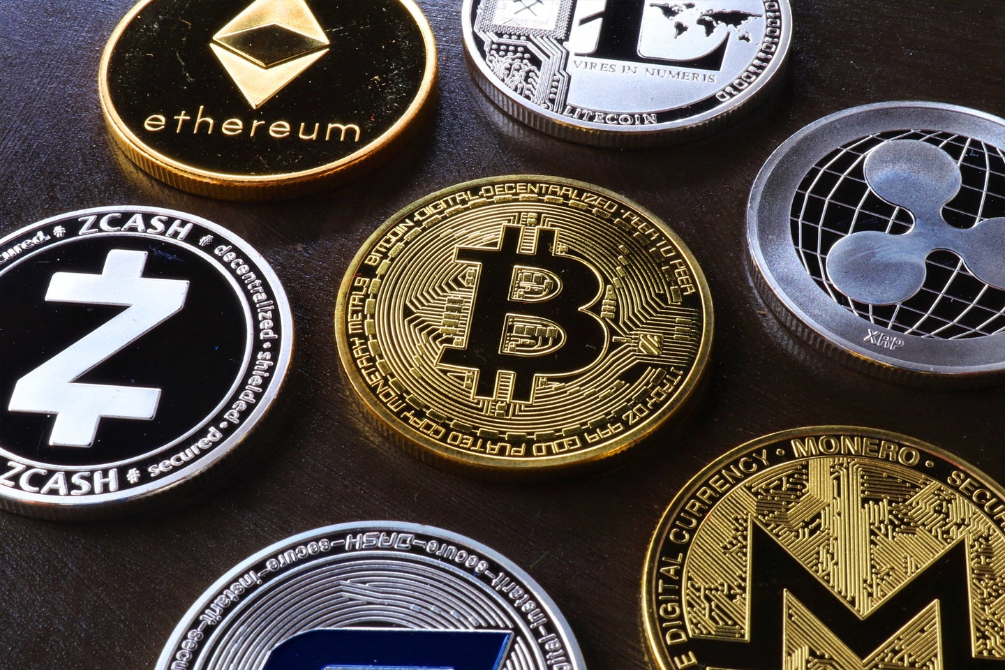 Physical depictions of digital cryptocurrency "coins" like Bitcoin, Ethereum, Zcash, and others.