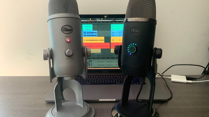 Blue Microphone Yeti and Yeti X in front of a computer