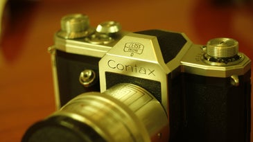 Vintage Contax camera on wooden table