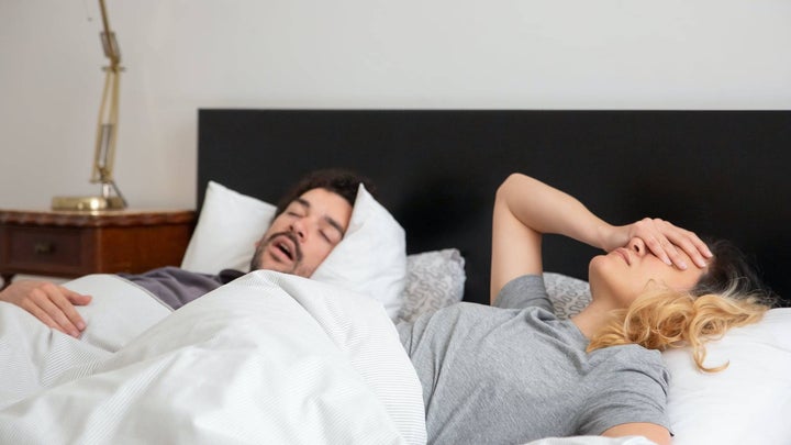 Frustrated couple in bed