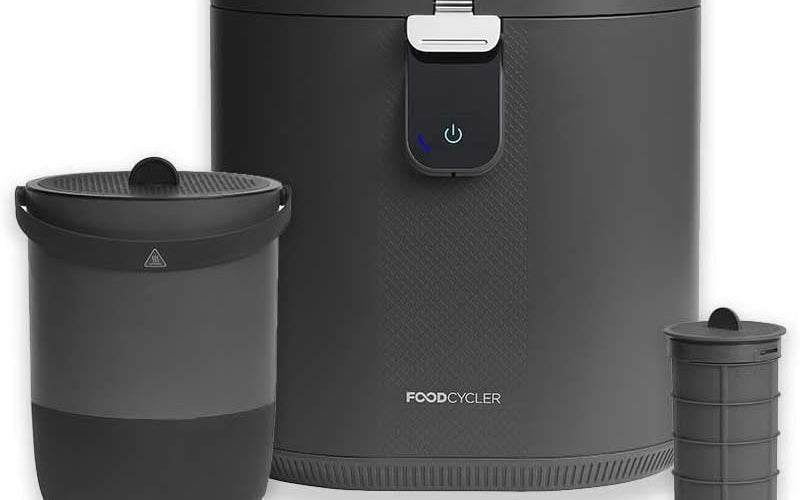 A slate-colored food composter from called the Eco 5 from Vitamix against a plain background.