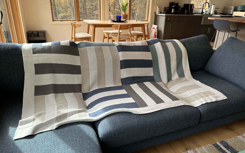 Double Stitch by Bedsure Throw Blanket on a blue couch