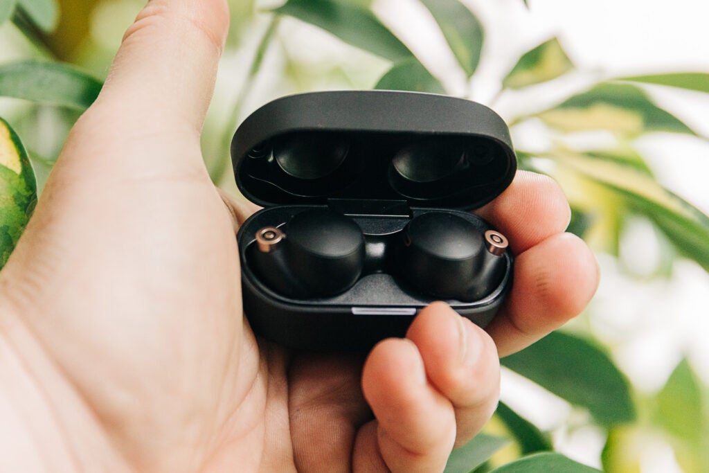 Sony wf-1000xm4 noise canceling earbuds in a hand