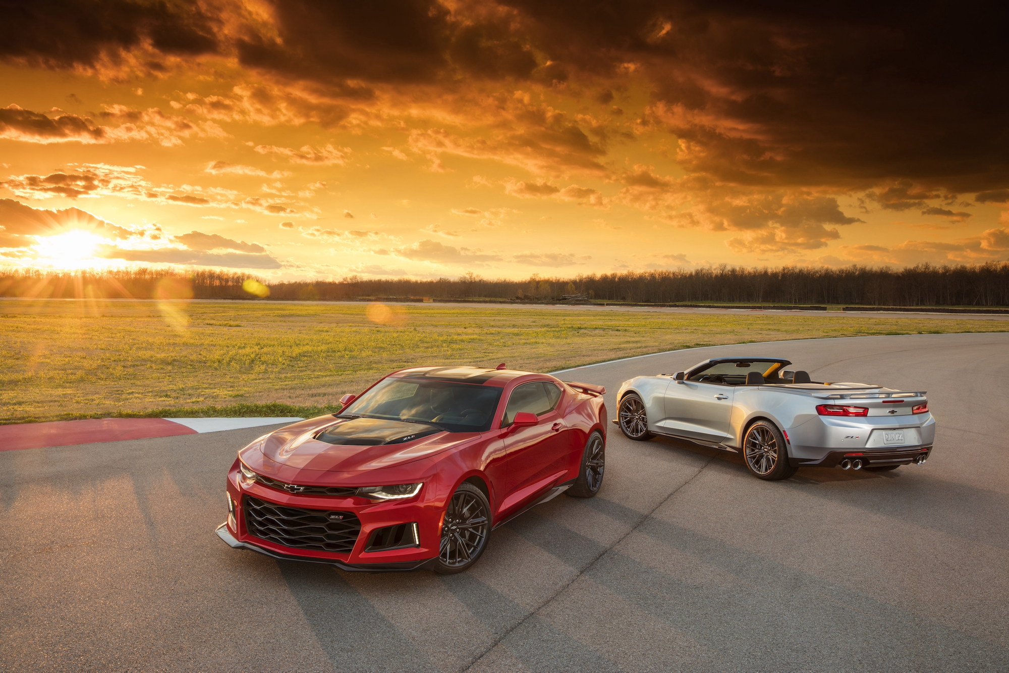 The 2018 Chevy Camaro. On the left, a coupe. On the right, a convertible. 