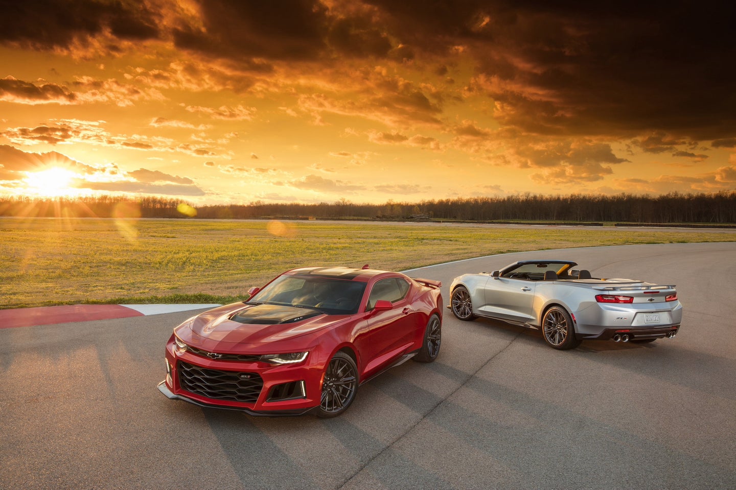 The 2018 Chevy Camaro. On the left, a coupe. On the right, a convertible. 