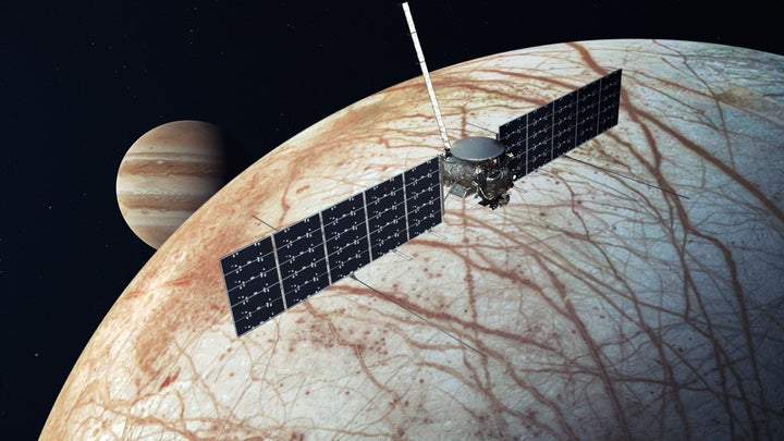 An artist's interpretation of the Europa Clipper spacecraft as it orbits Jupiter's frozen moon Europa.