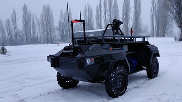 a robotic military vehicle in the snow
