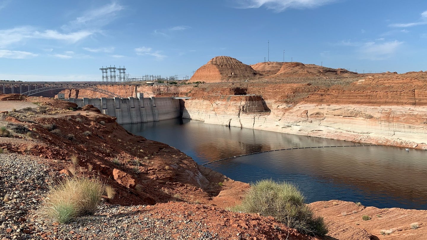 A dam on Lake Powell displays a chalky white bathtub-like ring that shows how much water reservoir levels have declined amid an ongoing drought.