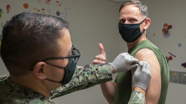 Military service member getting a COVID-19 vaccine shot